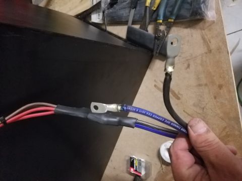 1994 Ford Bronco - Photograph of power cables terminated with ring lugs and heat shrink, not a technical document.