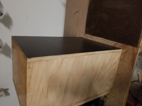 1994 Ford Bronco - Photograph of a partly finished plywood box, not a technical document.