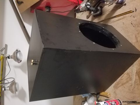 1994 Ford Bronco - Photograph of a black wedge enclosure with a driver cutout, not a technical document.