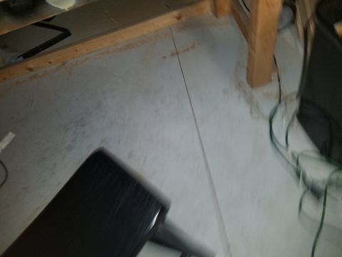 1994 Ford Bronco - Out-of-focus photograph of a workbench area, not a technical document.