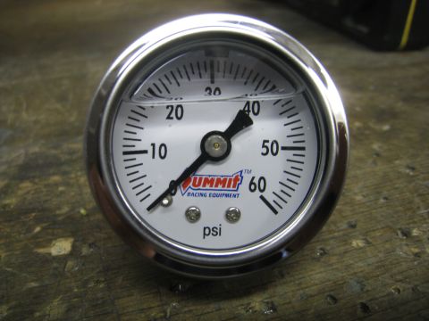 1996 Ford Bronco - A close-up of a Summit Racing Equipment branded pressure gauge with a needle pointing to approximately 32 psi. The gauge is silver and whit…