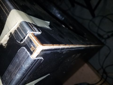 1994 Ford Bronco - Photo close-up of an aluminum extrusion joint on a speaker road case, not a technical document.