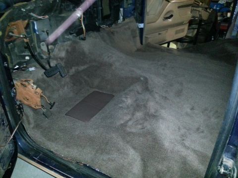 1994 Ford Bronco - Photo of a truck cab interior floor and carpet during a project, not a technical document.