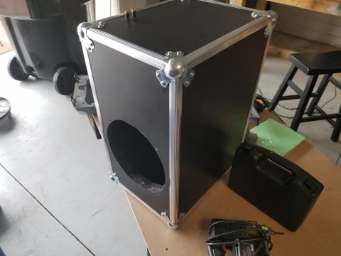 1994 Ford Bronco - Photo of a road-case speaker box with a circular driver opening, not a technical document.