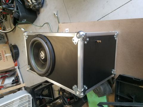1994 Ford Bronco - Photo of a road-case enclosure with a mounted subwoofer driver, not a technical document.