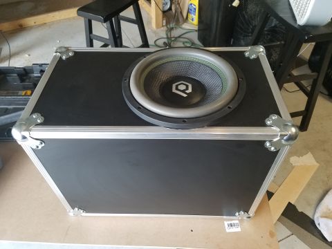 1994 Ford Bronco - Photo of a subwoofer driver installed in a road-case box, not a technical document.