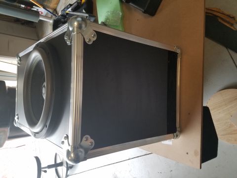 1994 Ford Bronco - Photo of a road-case subwoofer enclosure with a visible driver, not a technical document.