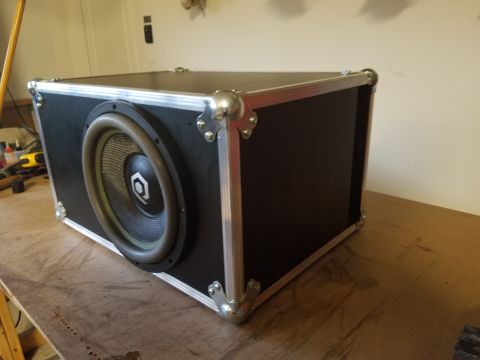 1994 Ford Bronco - Photo of a finished road-case subwoofer enclosure with mounted driver, not a technical document.