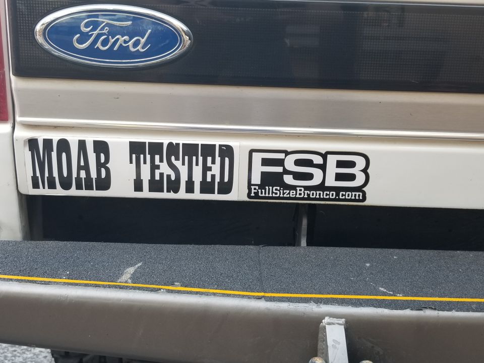 Rear of a Ford Bronco with "MOAB TESTED" and "FSB FullSizeBronco.com" stickers.