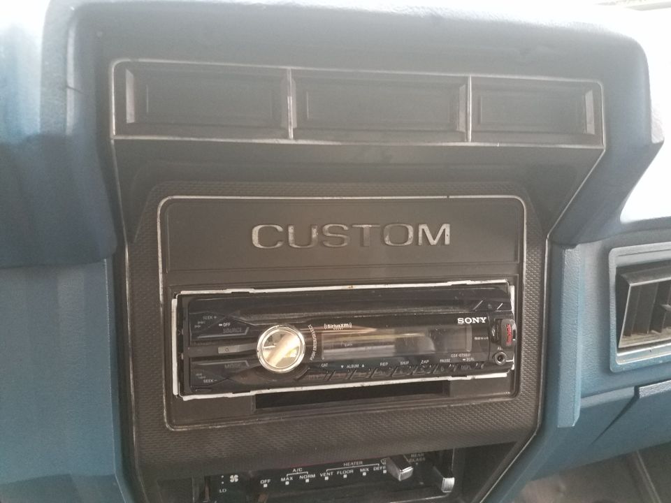 Close-up of a car dashboard with a Sony stereo and air vents.