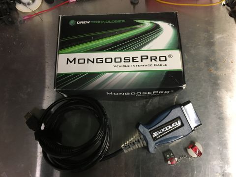 1996 Ford Bronco - A Drew Technologies MongoosePro Vehicle Interface Cable is shown with its box, USB cable, and a small USB drive with a chain.