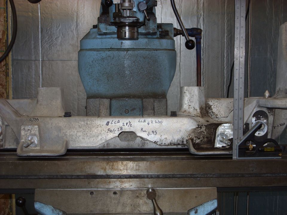 Machinery part with handwritten measurements and a ruler