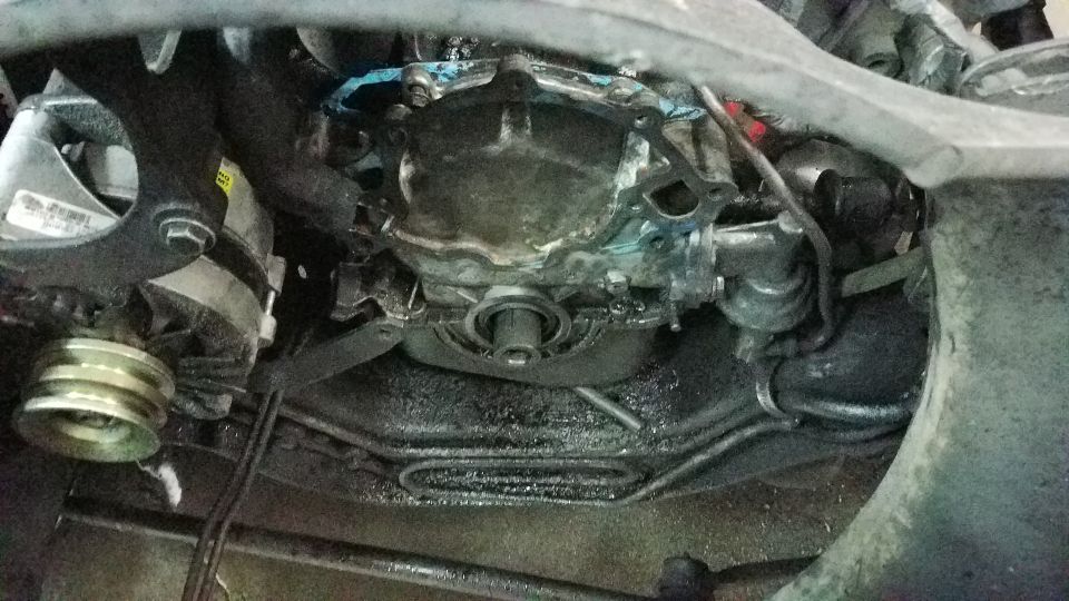 Engine transmission area with visible parts and SuperMotors logo