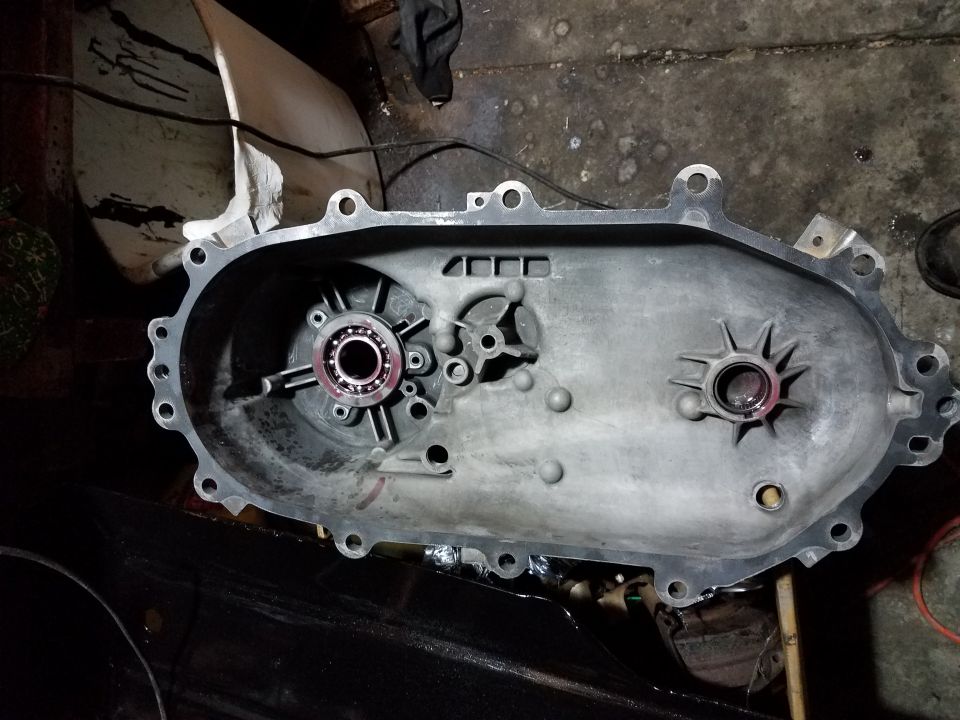 Transmission casing with bearing and gear components, metal, gray