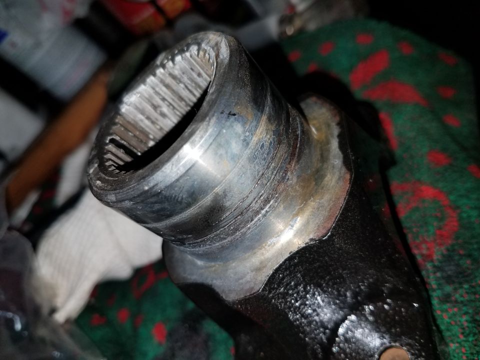Close-up of splined metal automotive part interior.