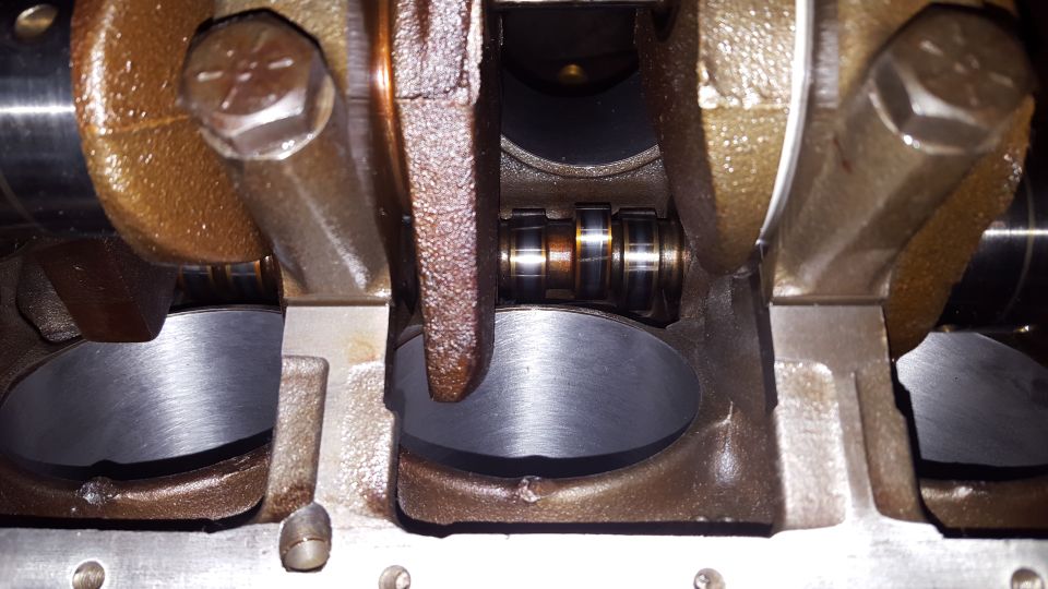 Close-up of engine crankshaft and connecting rod assembly