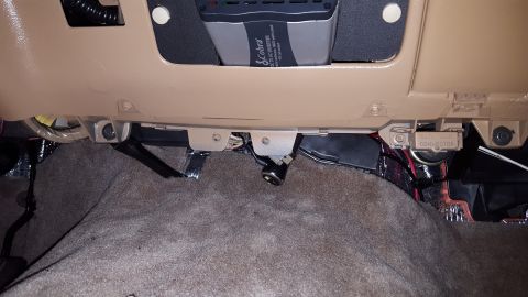 1996 Ford Bronco - This is an interior shot of a vehicle's dashboard, showing a Cobra DC to AC inverter mounted above a data link connector. The area below th…
