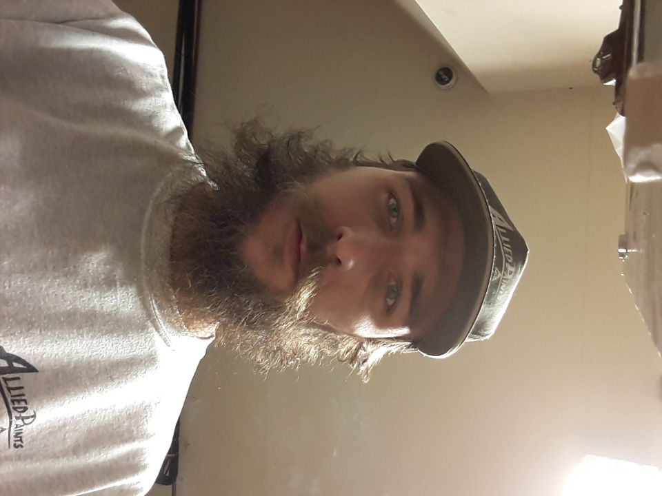 Man with a long beard and a baseball cap