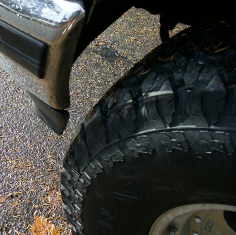 1992 Ford Bronco - 33" Grabbers rubbed a bit on the bumper and lip at stock ride height, requiring mild trimming.