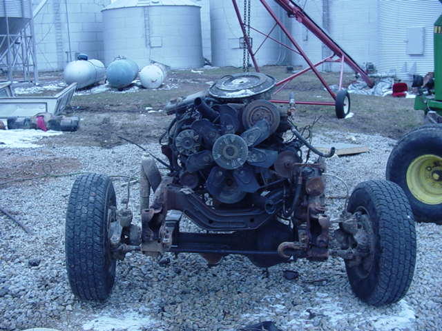 Vehicle engine and chassis with front wheel visible