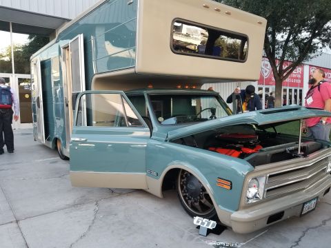 1969 Pontiac Firebird - This RV is built on a truck chassis, showing the engine compartment with the hood open.