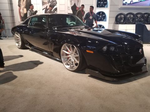 1969 Pontiac Firebird - Customized black pickup truck shown from a three-quarter front angle.