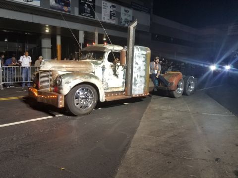 1969 Pontiac Firebird - A white truck is parked on a road at night, showing its front and side profile.