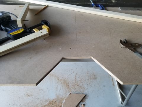 1994 Ford Bronco - Workbench setup with woodworking tools and materials, including clamps and pliers.
