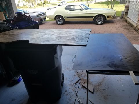 1994 Ford Bronco - A yellow 1973 Ford Mustang Mach 1 is parked in a driveway next to a modern Dodge Challenger.