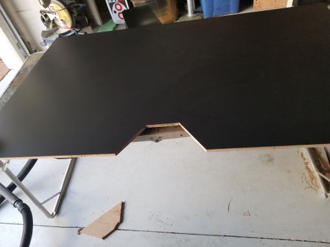 1994 Ford Bronco - A custom-cut wooden panel with a cutout is shown, possibly for a vehicle interior modification.