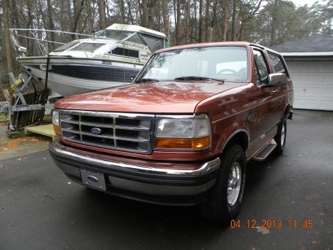 1988 Ford Bronco - This 1992 Ford Bronco is seen in a driveway with a boat in the background.