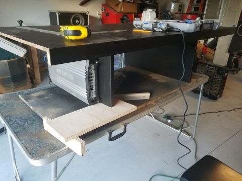 1994 Ford Bronco - A car amplifier is visible under a workbench, suggesting it is part of a stereo installation.