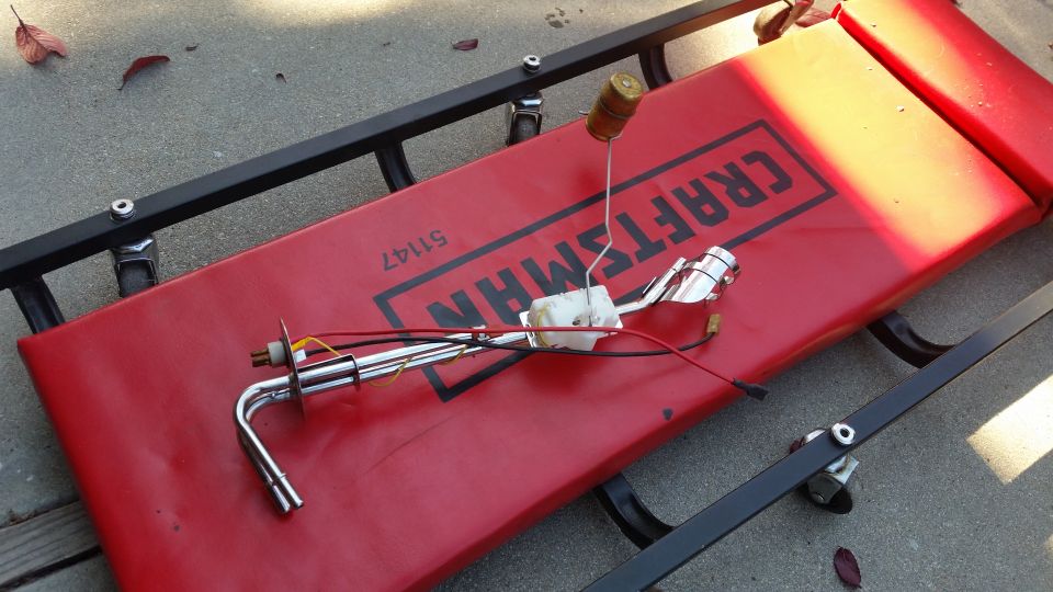 Fuel sending unit with float on a red Craftsman creeper