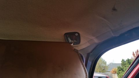 1985 Ford Bronco - The interior headliner shows significant sagging, indicating a potential issue with its attachment.