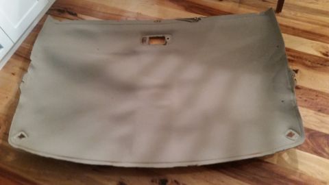 1985 Ford Bronco - Headliner removed from a vehicle, showing a rectangular cutout for a light fixture and mounting points.