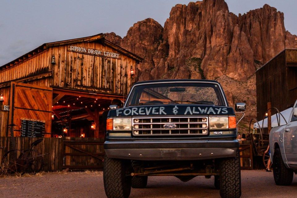 Dark blue Ford F-Series truck front view with 'FOREVER & ALWAYS' written on hood