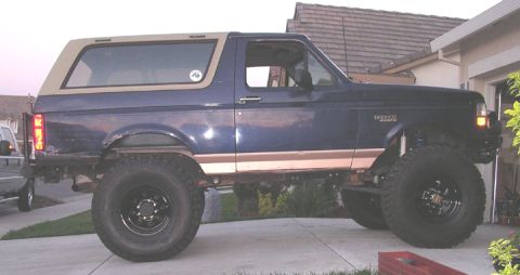 1994 Ford Bronco - passenger side. the lines flow OK. the "indent" where the body bends in at the rocker makes it appear like it isnt straight. It looks strai…