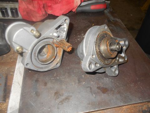 1992 Ford Bronco - Disassembled starter motors with visible rust on internal components.