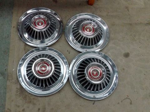 1964 Mercury Monterey - Set of four vintage Mercury hubcaps, identified by the badge as likely from 1964.