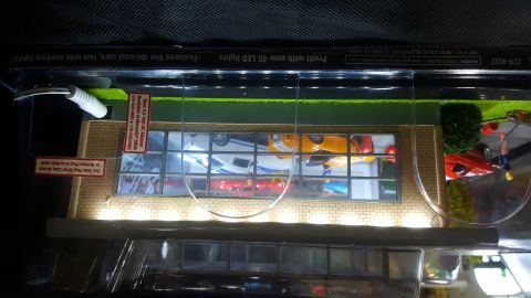1973 Ford Mustang - This model depicts a car dealership, complete with interior and exterior details, and multiple vehicles on display.