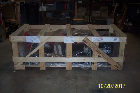1995 Ford Bronco - Wooden crate with parts inside, labeled 'SpeedMaster'.