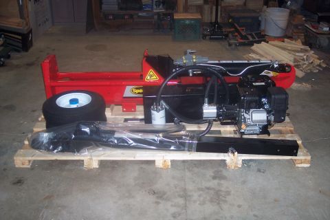 1995 Ford Bronco - A log splitter with its engine and hydraulic system is displayed on a pallet, ready for assembly or transport.
