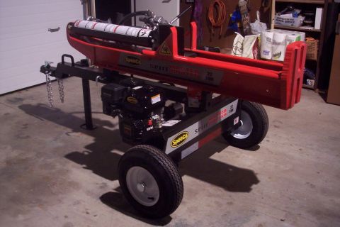 1995 Ford Bronco - A SpeedCo log splitter with a 22 ton capacity is parked indoors.