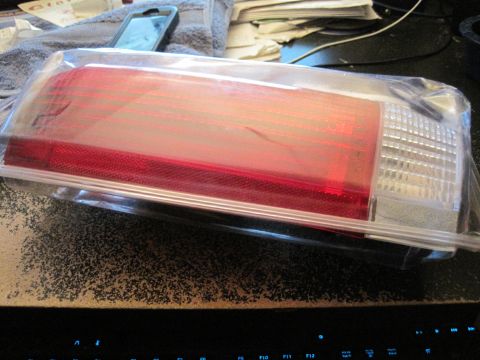 1989 Ford Bronco - Unused taillight assembly for a vehicle, still in its original protective packaging.