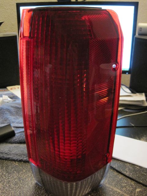1989 Ford Bronco - A close-up view of a red taillight assembly, likely a replacement part for a vehicle.