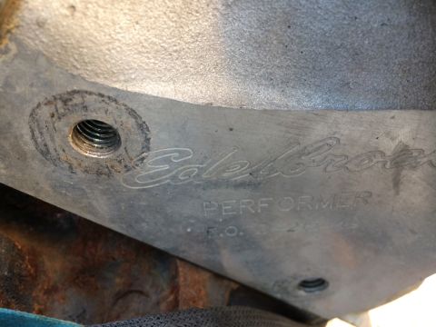 1989 Ford Bronco - Edelbrock Performer intake manifold part with visible casting marks and threaded holes.