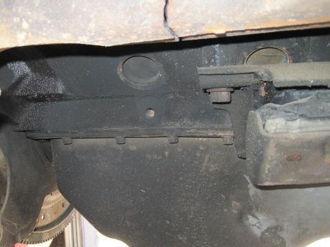 1989 Ford Bronco - Close-up view of an engine oil pan and frame section, likely from a donor vehicle.