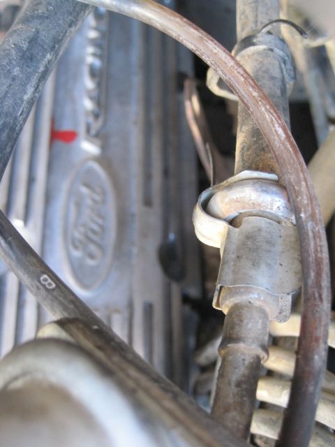 1989 Ford Bronco - Close-up of a Ford engine valve cover with various hoses and lines attached.