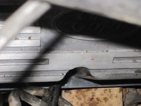 1989 Ford Bronco - A Ford logo is visible on a metal engine component, possibly from a 1989 Bronco.