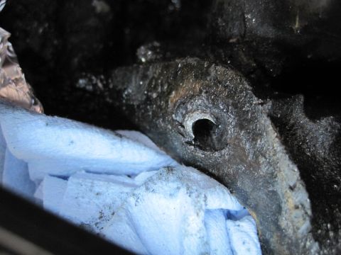1989 Ford Bronco - Engine part with blue shop towels, likely during reassembly or maintenance.